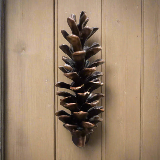 White pine cone bronze door knocker