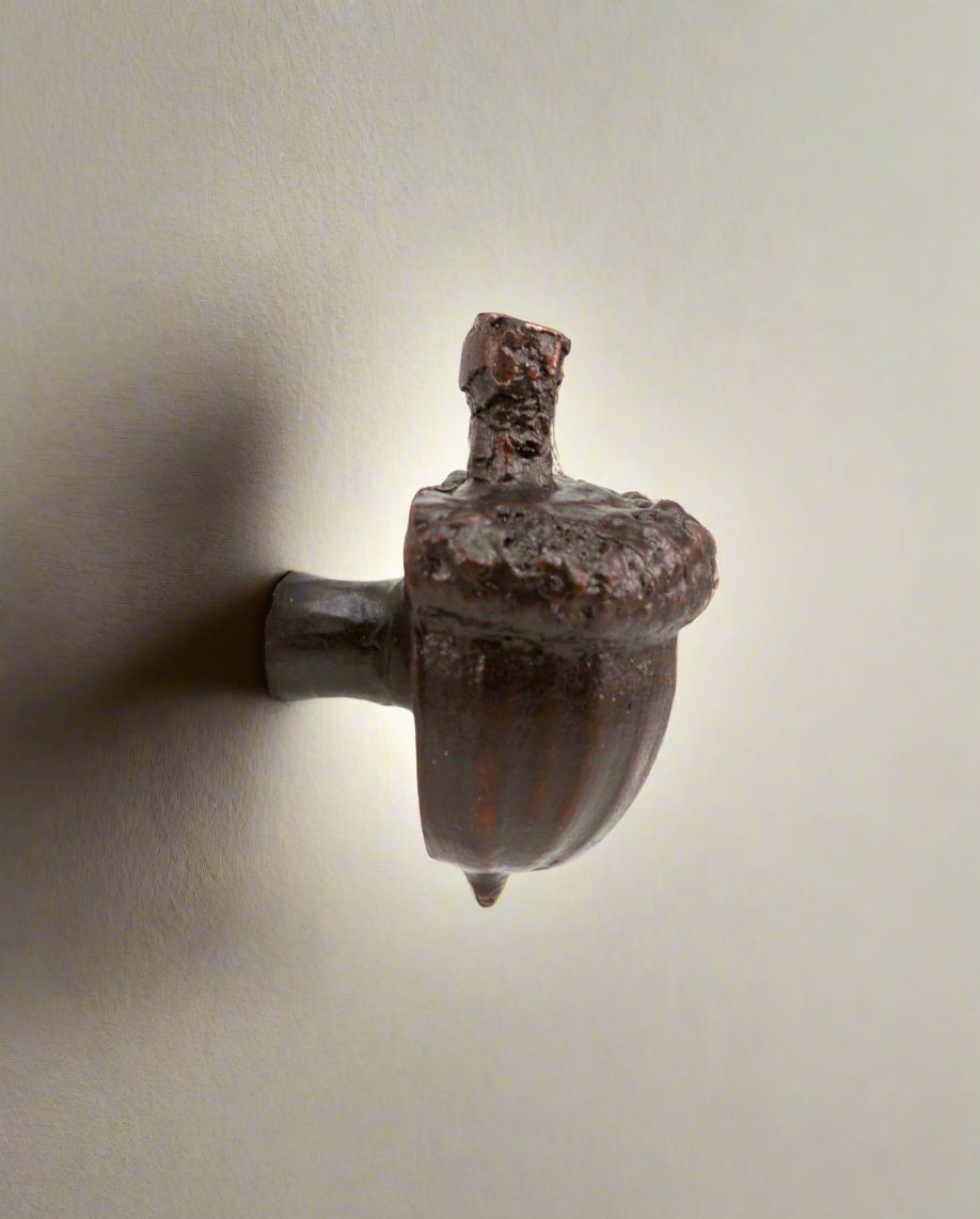 Bronze acorn cabinet knob with stem. Side view.