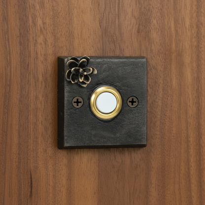 1/4" thick bronze square doorbell with bronze Western hemlock cone and gold push button.
